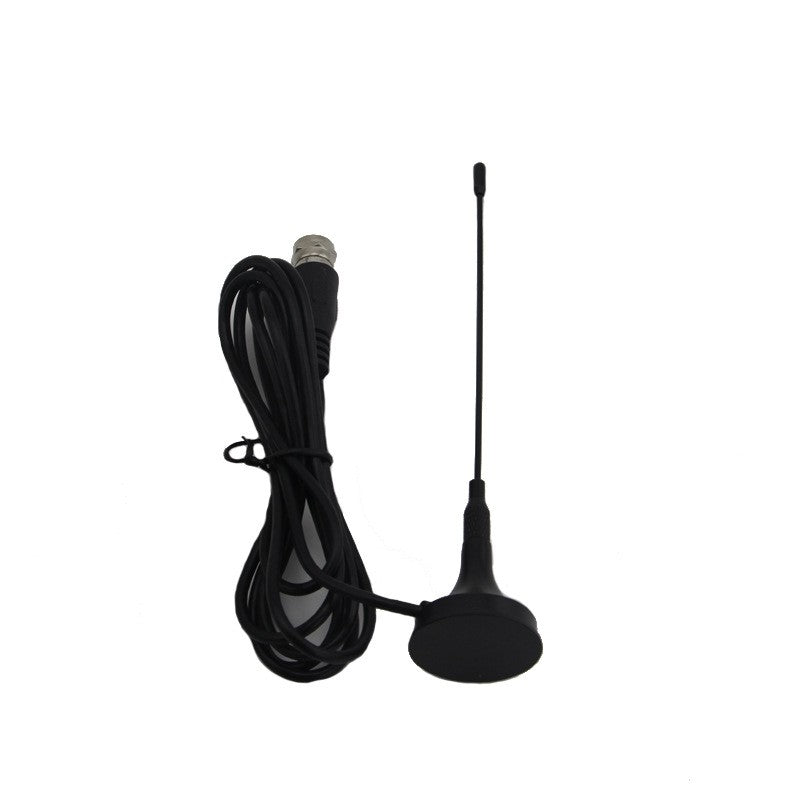 Antena de haste fina com base e cabo enrolado ao lado.